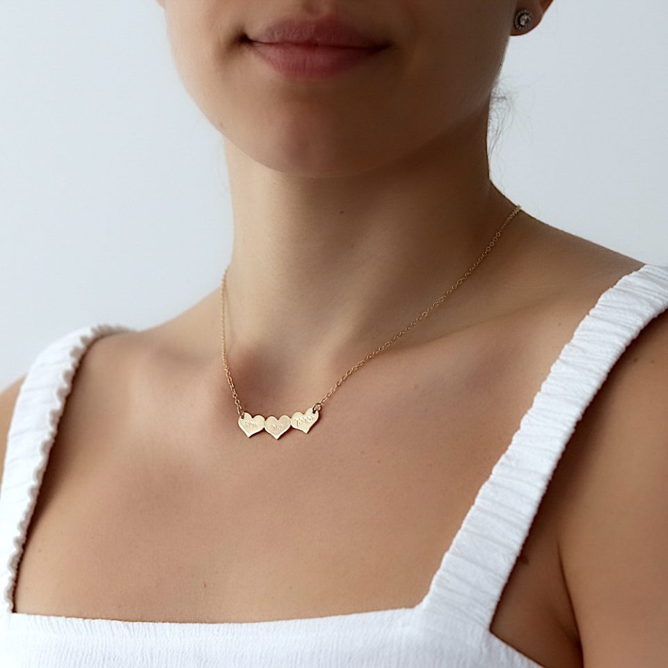 A necklace with engraved hearts pendants