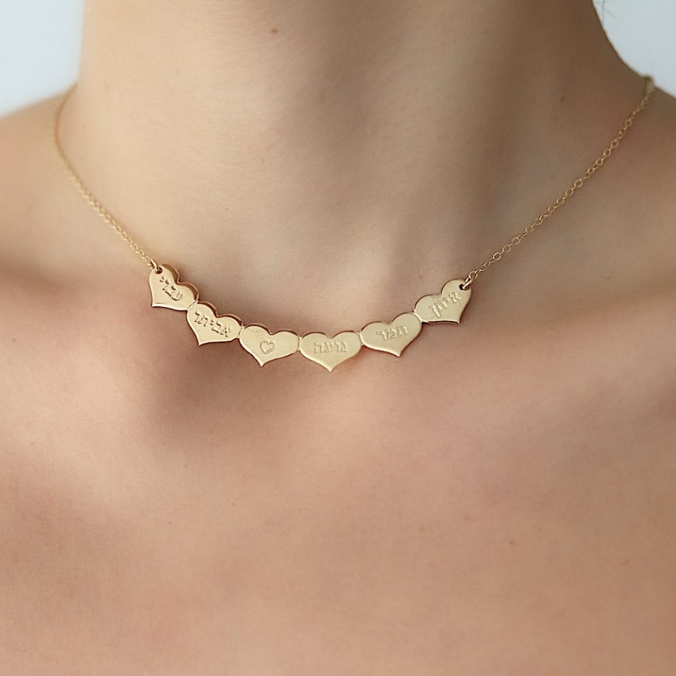 A necklace with hearts engraved pendants in gold plated