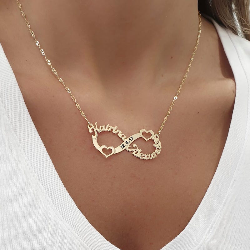 A necklace with infinity pendant with two name and hearts