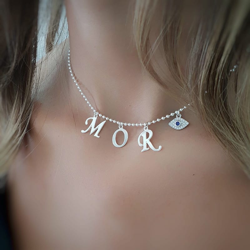 Letters necklace with studded eye