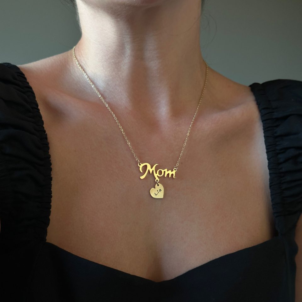 A necklace for a woman with a mom pendant with a heart for personal engraving