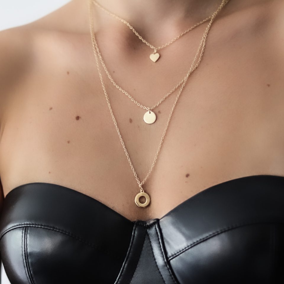 A necklace of 3 pendants, heart, circle, hoop