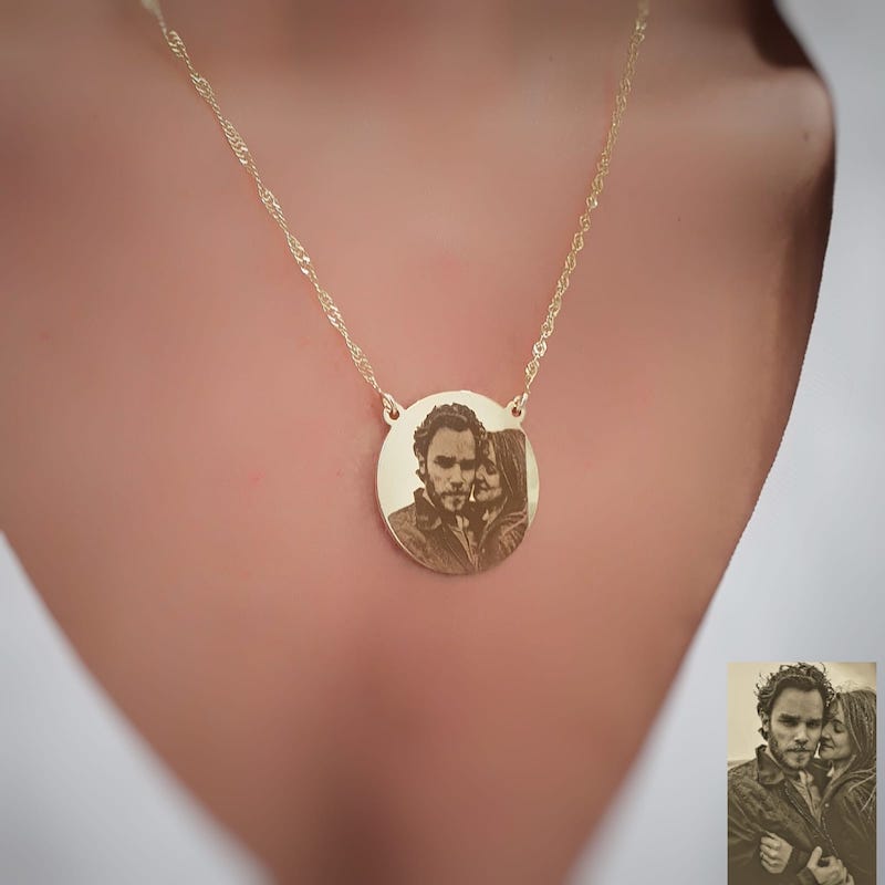 A necklace with photo engraving on pendant