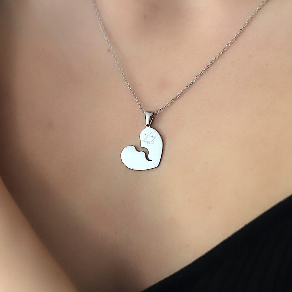 A necklace with a broken heart and the Shield of Israel