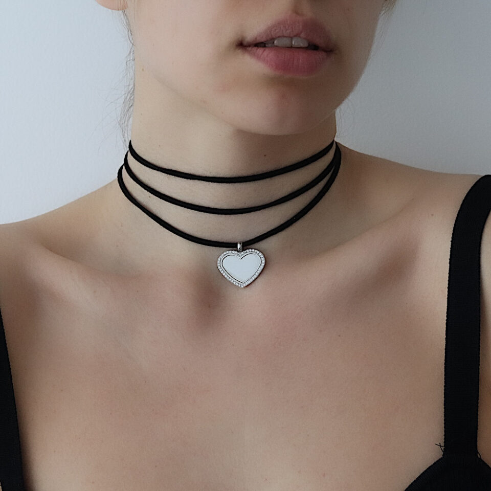 Choker with black cord with heart pendant set with stones